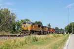 A mix of UP and BNSF power hauls empty oil cans west on the CP